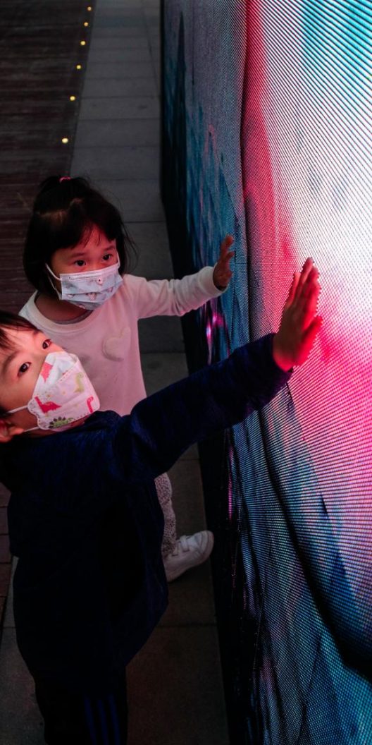 Image of children touching a screen