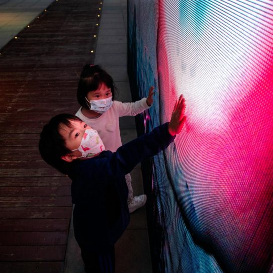 Image of children touching a screen